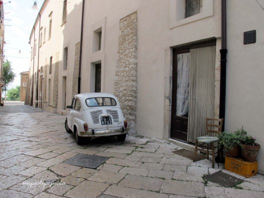 Side street in Troia with Fiat Seicento (600)