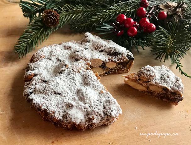 Panforte di Siena with holly and greenery
